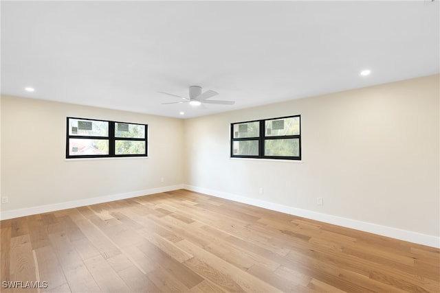 spare room featuring ceiling fan and light wood-type flooring