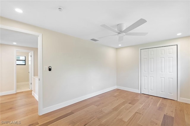 8531 Yorkshire Ln, Fort Myers, FL 33919 - unfurnished bedroom with light wood-style flooring, baseboards, a closet, and recessed lighting