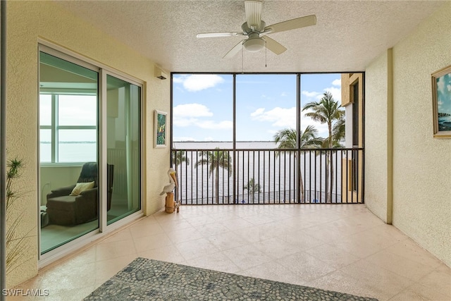 sunroom / solarium with ceiling fan