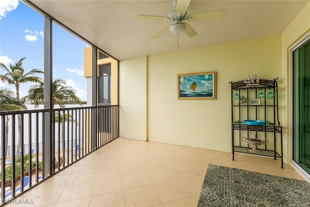 sunroom with ceiling fan and plenty of natural light