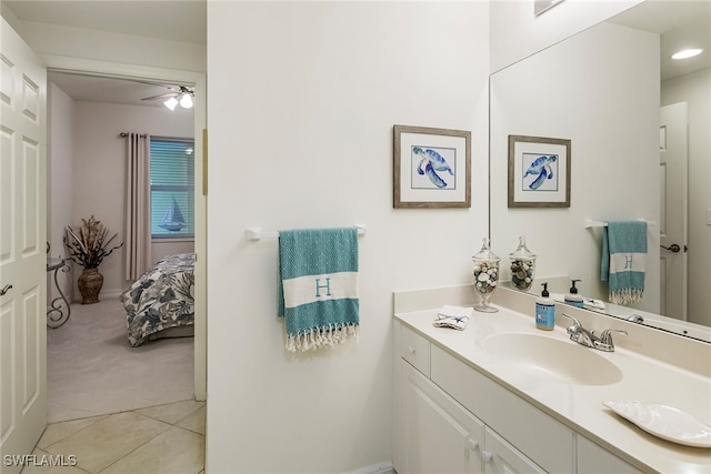 bathroom featuring vanity, ceiling fan, and tile patterned flooring