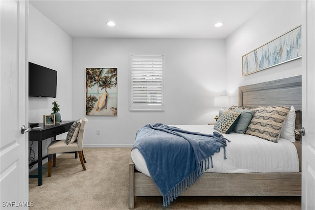 bedroom featuring light carpet