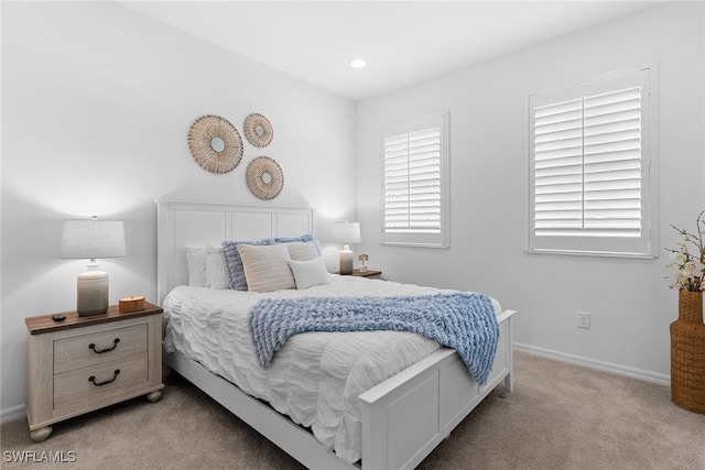 bedroom with light carpet