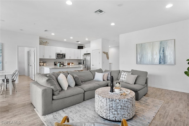 living room featuring light hardwood / wood-style floors