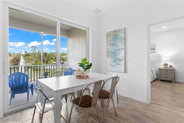 dining space featuring light hardwood / wood-style floors