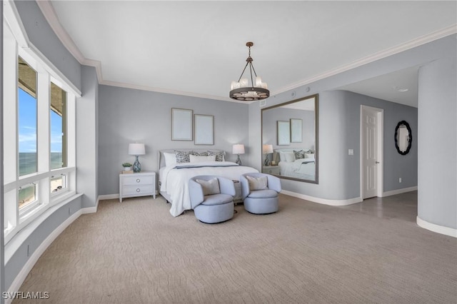 carpeted bedroom featuring ornamental molding and an inviting chandelier