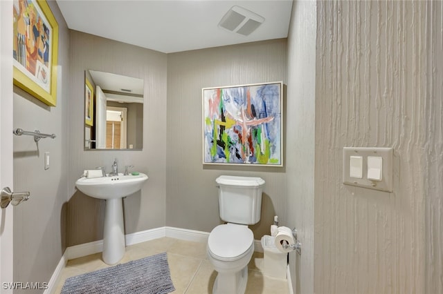 6081 Silver King Blvd Unit 206, Cape Coral, FL 33914 - half bath featuring toilet, tile patterned floors, visible vents, and baseboards