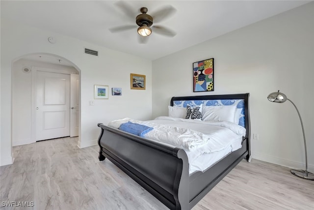 bedroom with ceiling fan and light hardwood / wood-style flooring