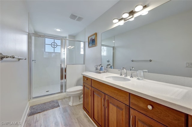 6081 Silver King Blvd Unit 206, Cape Coral, FL 33914 - full bath featuring visible vents, a stall shower, wood finished floors, vanity, and toilet