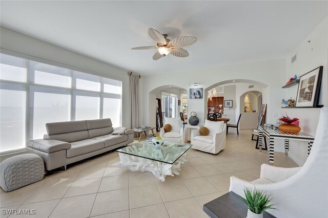 6081 Silver King Blvd Unit 206, Cape Coral, FL 33914 - living room featuring visible vents, arched walkways, ceiling fan, and light tile patterned floors