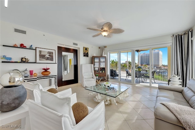 living room featuring ceiling fan and light tile patterned flooring