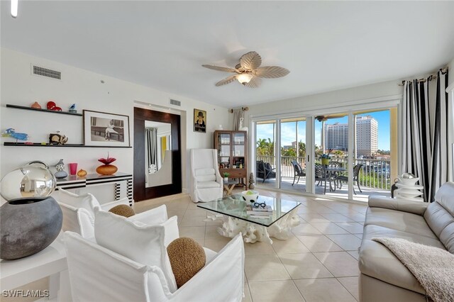 6081 Silver King Blvd Unit 206, Cape Coral, FL 33914 - living room with a ceiling fan, visible vents, and light tile patterned floors