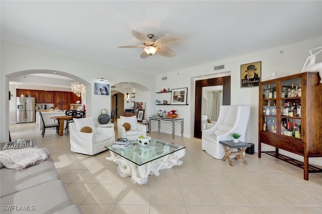 living room with ceiling fan and light tile patterned floors