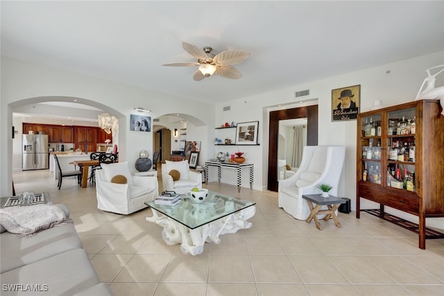 6081 Silver King Blvd Unit 206, Cape Coral, FL 33914 - living room with arched walkways, a ceiling fan, visible vents, and light tile patterned floors