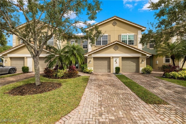 view of front facade with a front lawn and a garage