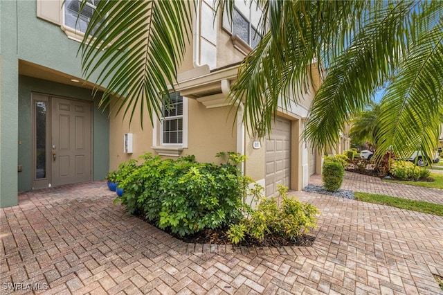 entrance to property featuring a garage