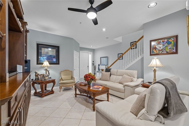 tiled living room featuring ceiling fan