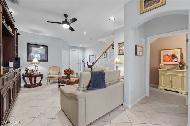 tiled living room with ceiling fan