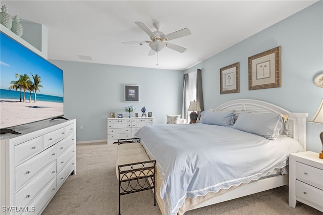 bedroom featuring light carpet and ceiling fan