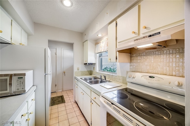 kitchen with white cabinetry, a textured ceiling, sink, and white appliances