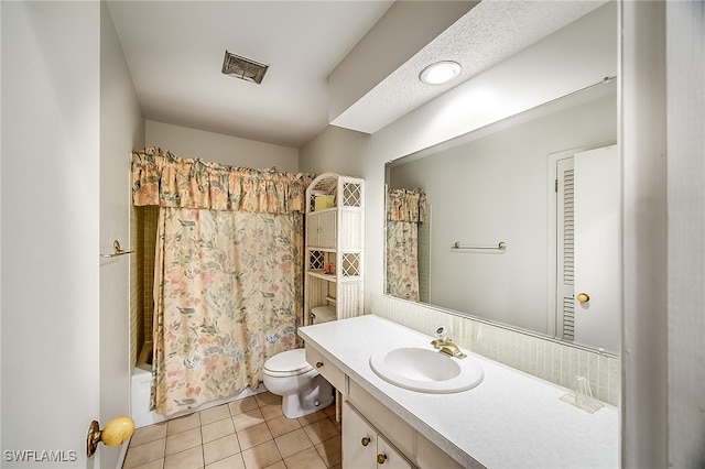 full bathroom with vanity, shower / tub combo, toilet, and tile patterned flooring