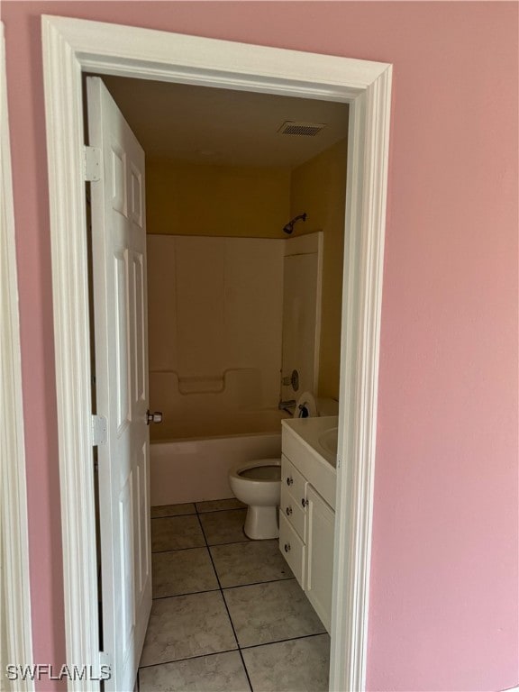 full bathroom with vanity, toilet, tile patterned floors, and tub / shower combination