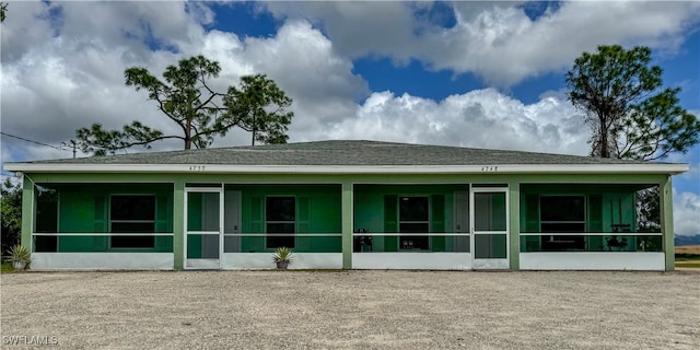 back of property featuring a sunroom