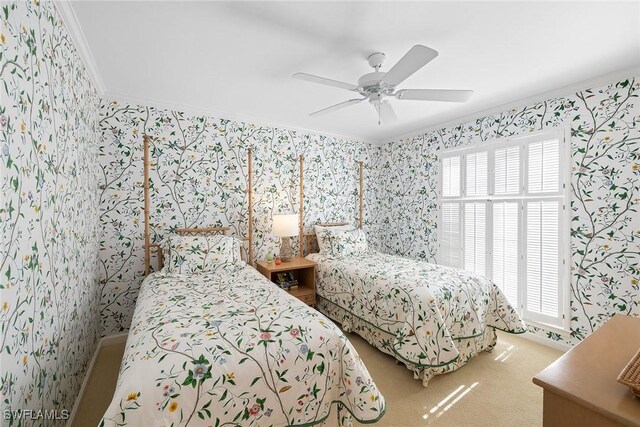 3323 Gin Ln, Naples, FL 34102 - bedroom with crown molding, wallpapered walls, and ceiling fan