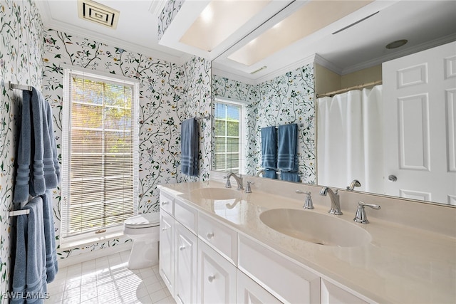 bathroom featuring tile patterned flooring, vanity, toilet, and crown molding