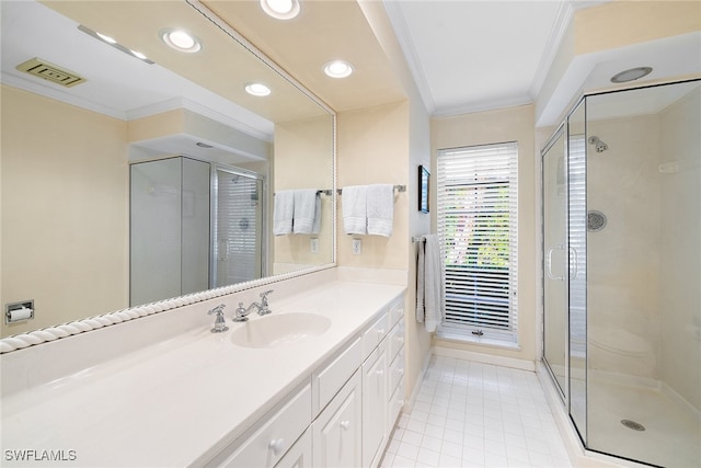 bathroom featuring tile patterned flooring, vanity, an enclosed shower, and ornamental molding