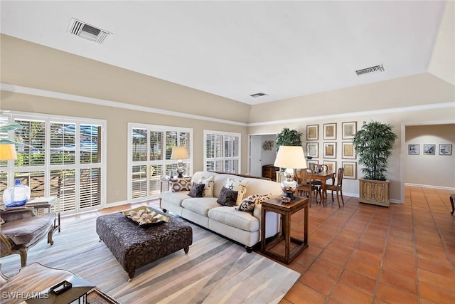 3323 Gin Ln, Naples, FL 34102 - tiled living area featuring baseboards and lofted ceiling
