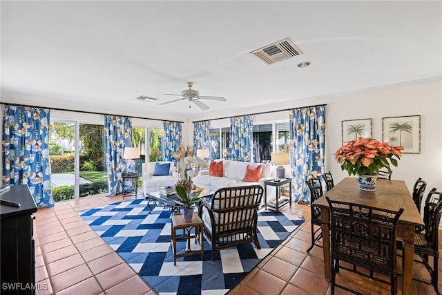 tiled dining area featuring ceiling fan