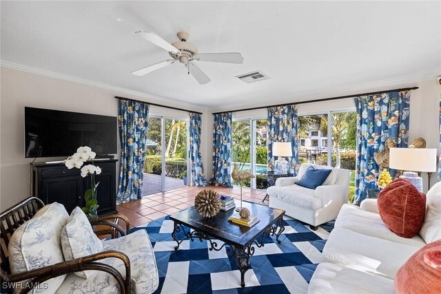 3323 Gin Ln, Naples, FL 34102 - living room featuring healthy amount of natural light, ceiling fan, and ornamental molding