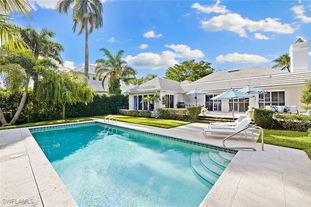 view of pool featuring a patio