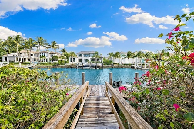 3323 Gin Ln, Naples, FL 34102 - dock area featuring a water view and a residential view