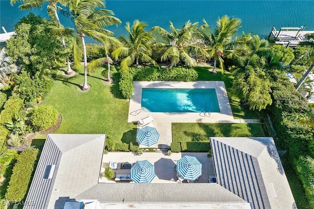 birds eye view of property with a water view