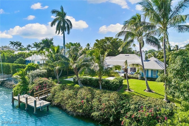 3323 Gin Ln, Naples, FL 34102 - view of home's community featuring a water view, a boat dock, and a yard