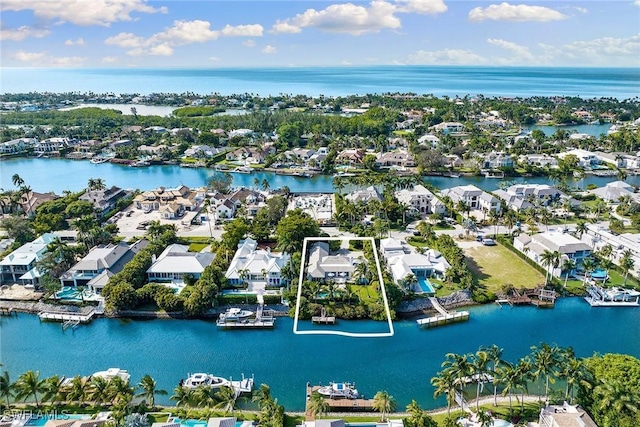 3323 Gin Ln, Naples, FL 34102 - aerial perspective of suburban area featuring a nearby body of water and property parcel outlined