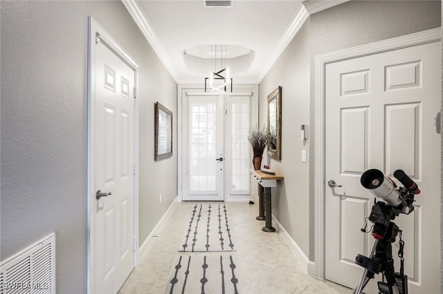 entryway featuring light tile patterned floors and ornamental molding