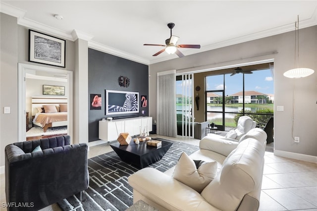 living area with light tile patterned floors, ceiling fan, ornamental molding, and baseboards