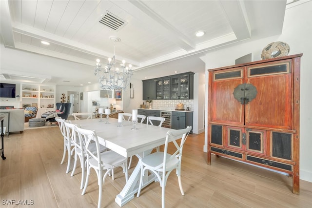 dining space featuring wood ceiling, beam ceiling, light wood-type flooring, beverage cooler, and a chandelier