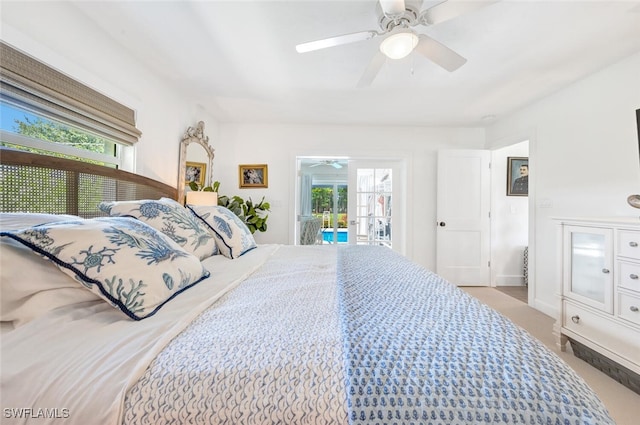 bedroom featuring ceiling fan, access to outside, and multiple windows