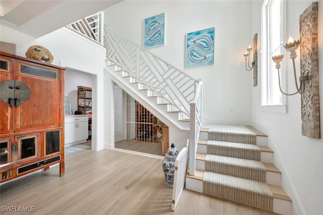 staircase featuring wood-type flooring