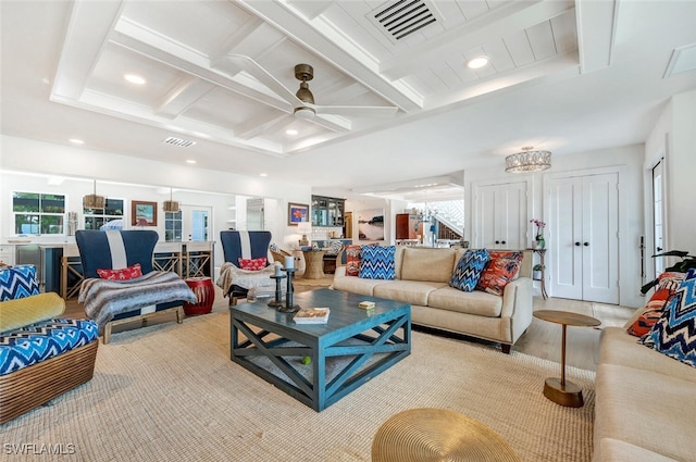 living room featuring beam ceiling, coffered ceiling, light hardwood / wood-style flooring, and ceiling fan