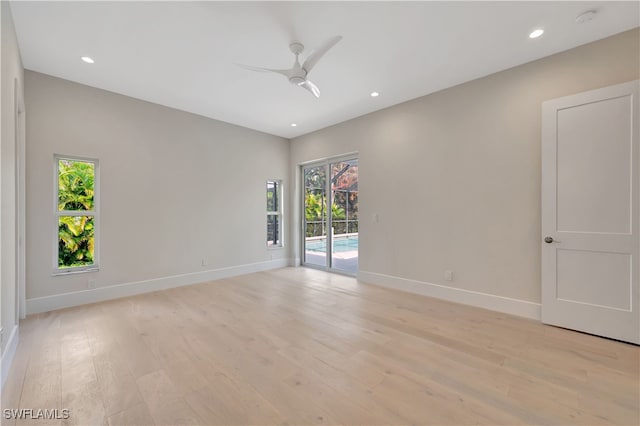 unfurnished room featuring light hardwood / wood-style floors and ceiling fan