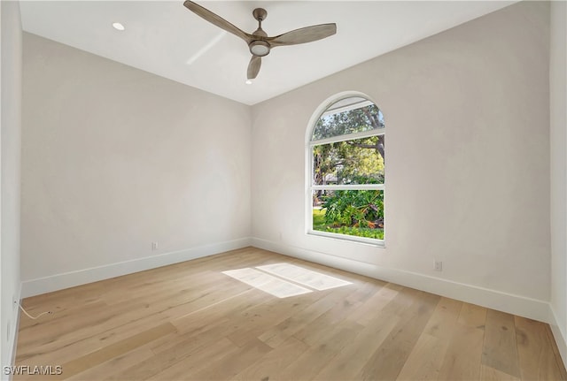 unfurnished room with light hardwood / wood-style flooring and ceiling fan