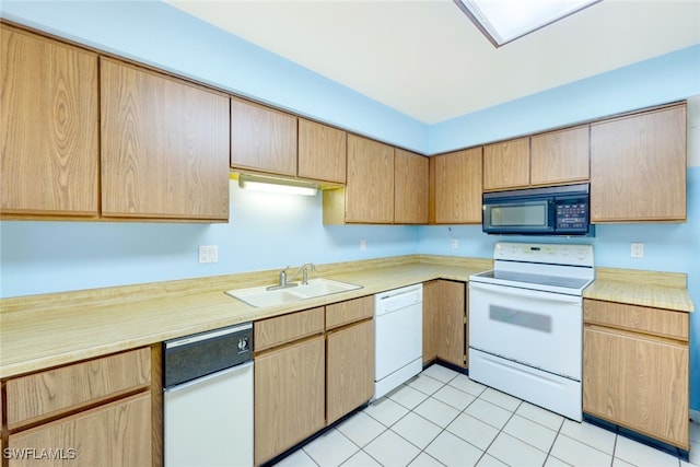 kitchen with white appliances, sink, and light tile patterned flooring