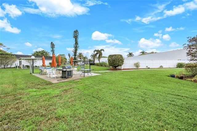 view of yard with an outdoor fire pit and a patio area