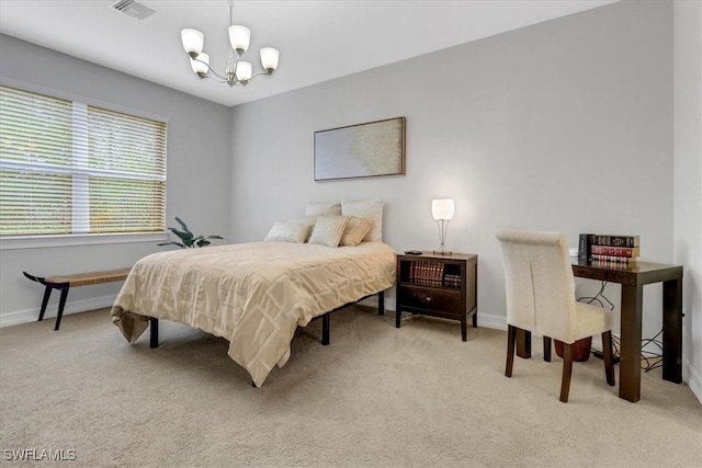 carpeted bedroom with a chandelier