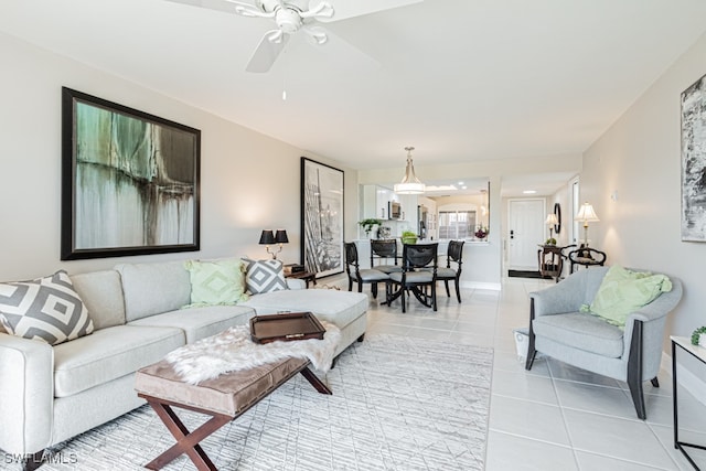 tiled living room featuring ceiling fan